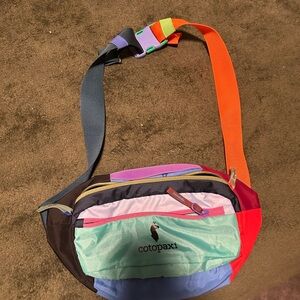 Cotopaxi Colorful Crossbody Bag with Red and Green Accents